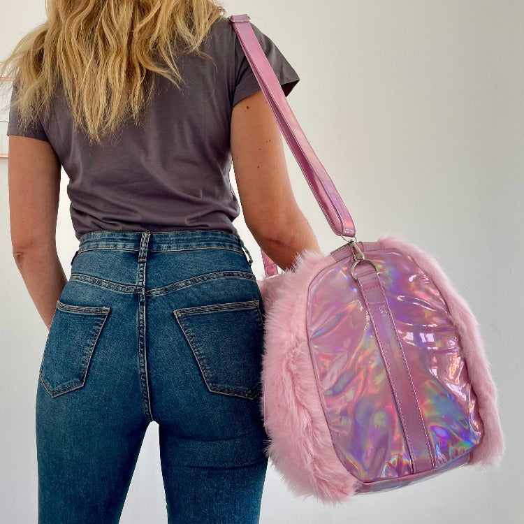 The Fay Furry Weekender comes with a detachable leather shoulder strap and two handles so you can easily switch from shoulder to tote. With this extra roomy furry weekender, you can easily fit a few of your favorite outfits, shoes, and cosmetics into this fun carry-on.