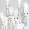White and Pink Colored Portable Humidifiers with deer antlers in clear bottles of water - white background