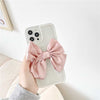 Load image into Gallery viewer, Iridescent Pearl Belle Bow Case showing back of phone with white pearl trim &amp; millenial pink linen bow