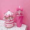 Load image into Gallery viewer, Hot pink Belle bow cup next to pink toy carousel - hot pink background - home &amp; office