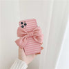Geometric striped Pink Belle Bow Case showing back of phone and soft pink linen bow