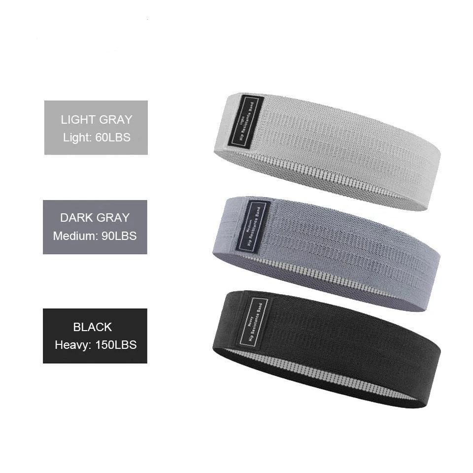 Blogger booty bands - accessories Light gray, dark gray & black exercise bands on display showing their weight-relative resistance. Light gray is 60, dark gray is 90 & black is 150lbs resistance.