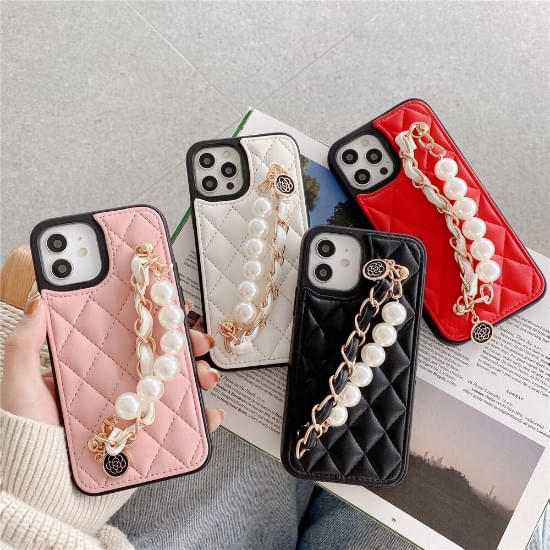 Four variants of the Claire Camelia Quilted Phone Cases, pearl and chain link straps visible. From left to right: pink, white, black & red