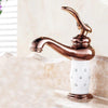 Coco glam faucet - 2 / short - home & office polished rose gold faucet set against the white bejewelled ceramic core. Beige marble counter contrasts making the deep rose a more stunning fixture