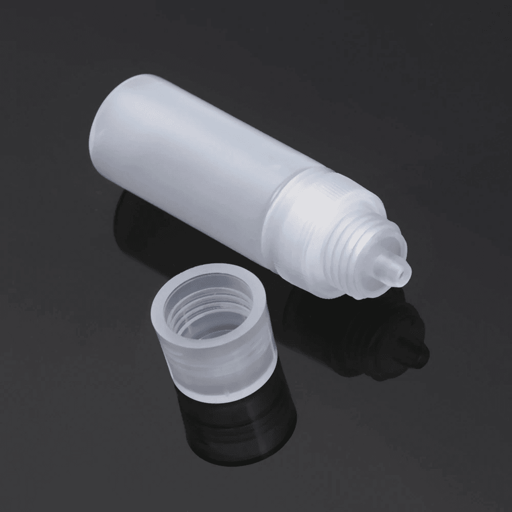 Unity contacts kit - accessories. Lens solution bottle and screw-top cover holding exactly the TSA liquid limit carry on per container